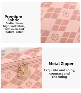 Macro detail of pink handbag showing four-leaf clover quilting and golden dual zippers