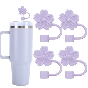 Close-up of five purple cherry blossom silicone straw covers for 10mm tumbler straws