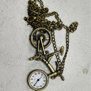 Retro bronze bicycle pocket watch with quartz movement on vintage metal chain