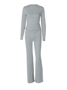 Women's grey two-piece set featuring long sleeve crewneck top and flared knit trousers