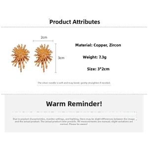 Macro detail of firework gold earrings with cubic zirconia inlay and silver pins