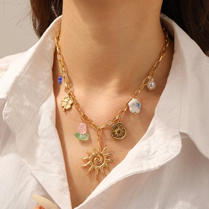 Gold stainless steel chunky chain necklace with sun, floral, pearl and compass charms