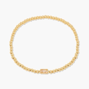Bracelet minimaliste en perles dorées avec un zircon rectangulaire transparent au centre