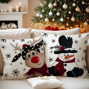 Detail of Christmas white deer and snowman linen pillow covers on a cozy sofa