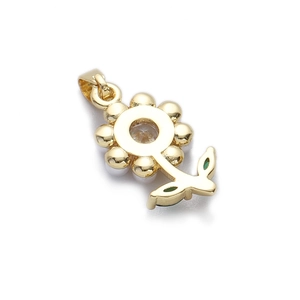 Détail du pendentif fleur de tournesol doré avec pierre en zircon et petites feuilles vertes