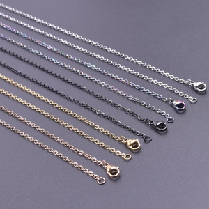 Detail view of 2mm stainless steel cross chains in silver, gold, black, and rose gold finishes