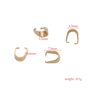 Detailed view of 3x7mm golden stainless steel pinch bails for DIY jewelry making