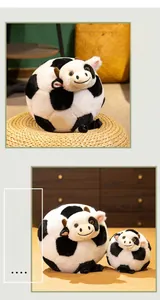 Macro detail of plush football cow toys in two sizes with soft black and white spots