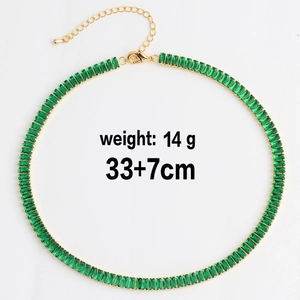 Close-up of green zircon tennis necklace with gold-plated claw chain and lobster clasp