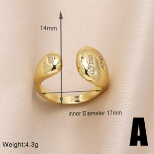 Detail of gold-plated open ring with cubic zirconia inlay and teardrop design