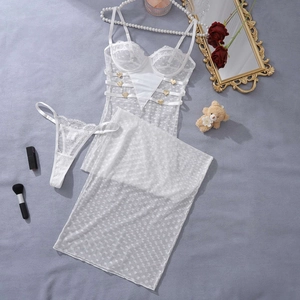 Close-up of white floral lace lingerie set with gold heart buckles and mesh skirt