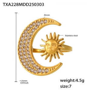 Detail of sun and moon stainless steel ring with zircon stones and embossed face