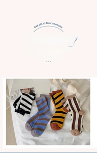 Detailed knit texture of cotton crew socks with horizontal stripes in multiple colors