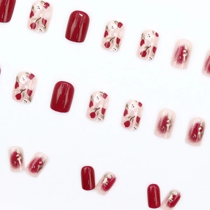 Short square red tulip press-on nails with gold foil accents and floral patterns