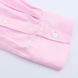 Pink linen long sleeve shirt for women featuring a close-up of cuffs and white buttons