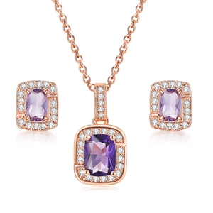 Detail view of rose gold jewelry set featuring purple gemstones and white zirconia