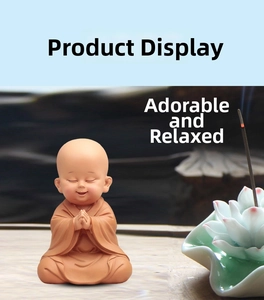 Macro detail of sitting monk ceramic figurine with incense burner on a lotus base