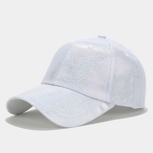 Detailed view of white glitter PU leather texture on a fashion baseball cap with sparkles