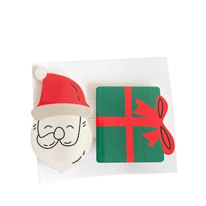 Cute Santa Claus and green gift box hair clips set on card with matte finish