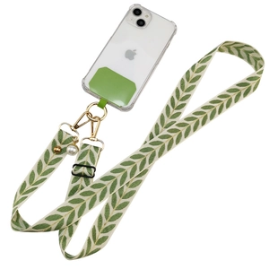 Adjustable crossbody phone strap with green leaf pattern, pearl charm and gold hardware