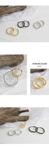 Detailed view of S925 sterling silver hoop earrings with visible metal hallmark stamp
