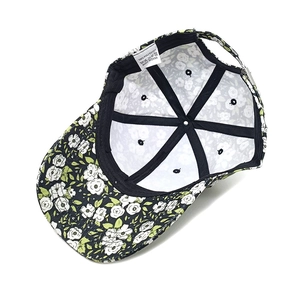 Internal view of floral baseball cap showing polyester fabric and 6-panel structure