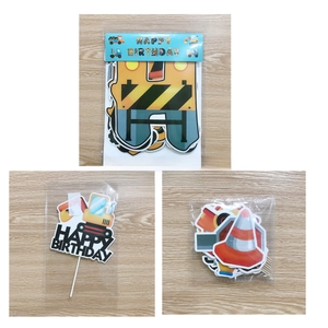 Detailed view of construction theme birthday party banners and excavator cake toppers set