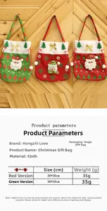 Detailed view of festive Christmas drawstring gift bags in red and green fabric with 3D appliques