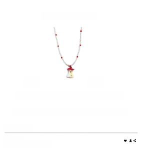 Detail view of crystal beaded necklace with apple pendant showing the 40cm length measure