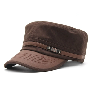 Detail of cadet hat with canvas crown, leather-like brim, metal rivets, and star stitching