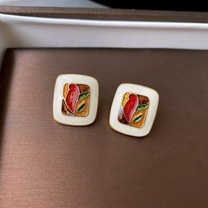Detail of square vintage oil painting earrings with red and amber enamel in gold frame