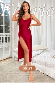 Detail of elegant red satin slip dress featuring a high side slit and adjustable thin straps