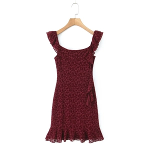 Sleeveless burgundy floral lace dress with ruffle straps and hem on a wooden hanger
