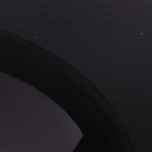 Macro detail of high-density black twill fabric with precise multi-row stitching on brim