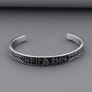 Detailed texture of Viking rune bracelet with oxidized Nordic knots and matte finish