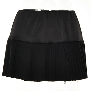 Detailed view of black pleated mini skirt with smooth top and accordion pleat design