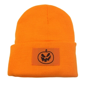 Orange Halloween knit beanie with embroidered black pumpkin skull patch for men and women