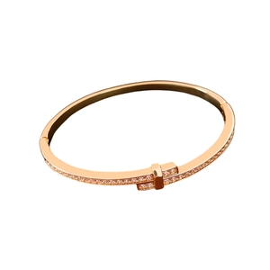18K gold plated bangle featuring a minimalist T-cross design with pavé-set crystals
