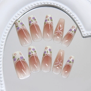 French bow press-on nails with purple floral gradient and long trapezoid shape