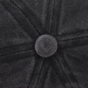 Macro view of the top button and stitched seams on the vintage New York baseball cap