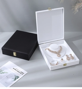 Detail view of premium jewelry box sets in black and white with soft velvet interior trays