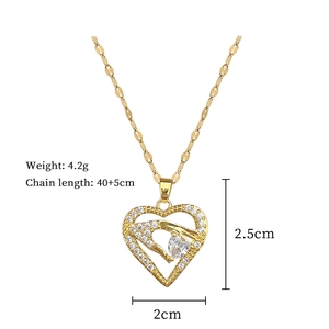 Detail view of gold heart necklace with full diamond inlay and specific measurements