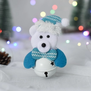 Detail of white plush bear ornament with blue plaid hat and star cutout metal bell
