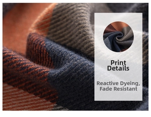 Detail of soft checkered scarf fabric showing active dyeing and vibrant orange-blue pattern