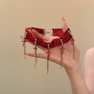 Red velvet choker with red rhinestone cross pendants and hanging metal tassels