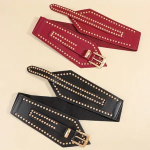 Women's wide elastic waist belt with gold stud embellishments in red and black