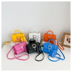 Detail view of retro crossbody bags in six vibrant colors with matching mini coin purses