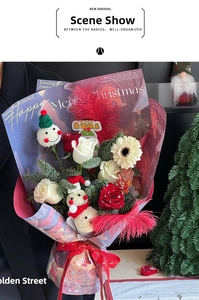 Close-up of Christmas bouquet with red roses, snowmen decorations and festive wrapping
