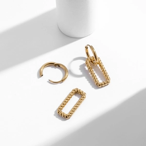 Chic hollow twist pattern square drop earrings in gold plated stainless steel