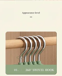 Detail of 360-degree rotating stainless steel hook on a white non-slip velvet clothes hanger
